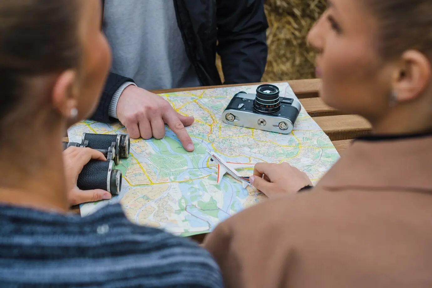 People seated at a table, navigating.